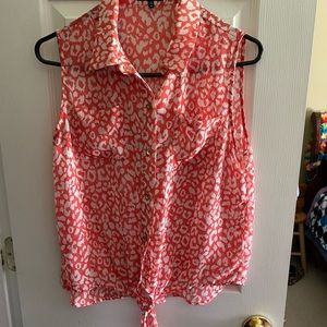 Pink and white sleeveless blouse